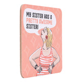 drinks coasters with illustration of a woman and text 'My sister has a pretty awesome sister!' on a pink background