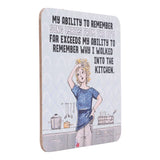 Drinks coasters with a humorous design of a woman in a kitchen and text about remembering song lyrics.