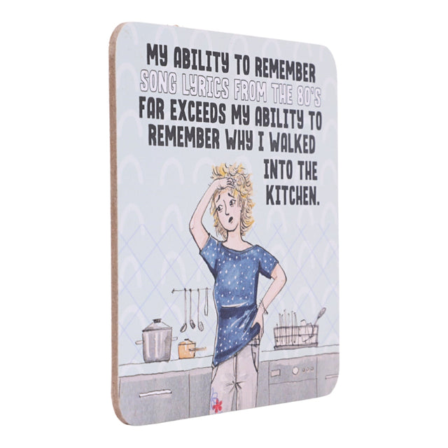 Drinks coasters with a humorous design of a woman in a kitchen and text about remembering song lyrics.