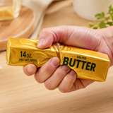 Gold butter slow-rise squishy toy shaped like a realistic butter block