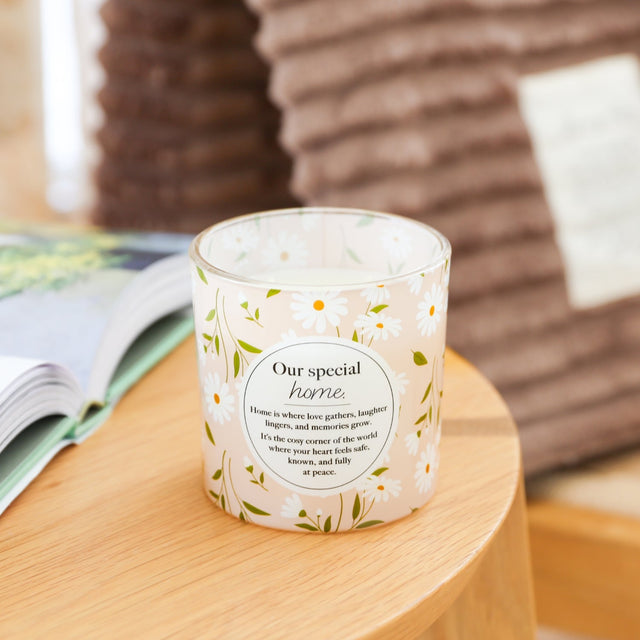 Scented candle gift for a new home with soft floral design
