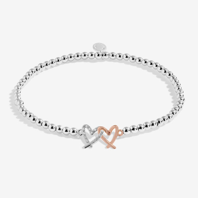 Joma A Little Love You Bestie bracelet presented on illustrated friendship sentiment card