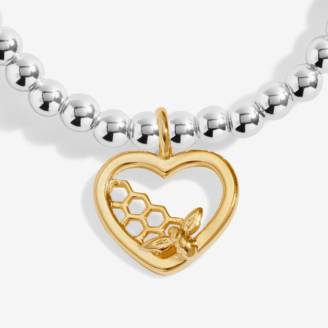 Close-up of gold bee heart charm on Joma Make Today Bee-utiful bracelet