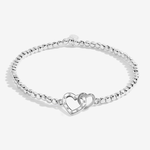 Silver plated beaded bracelet with interlinked heart charms for gran