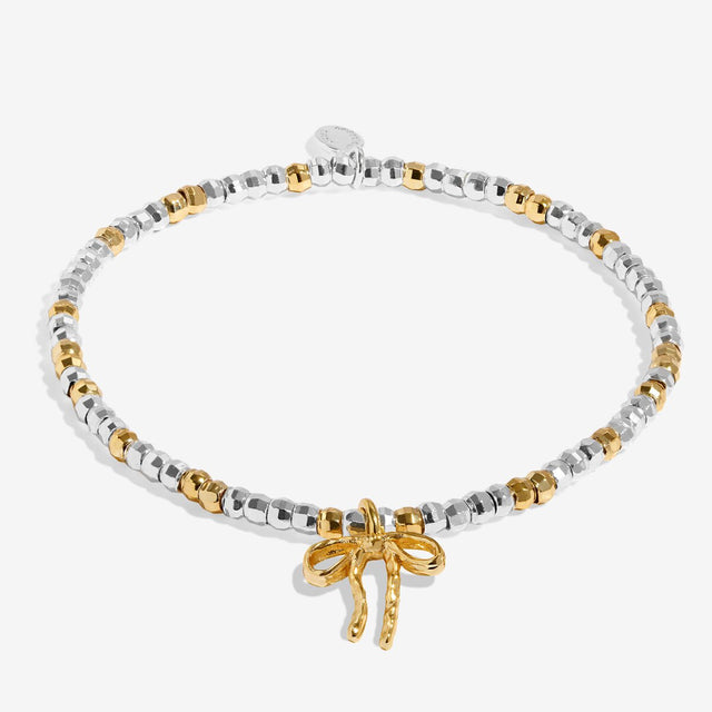 Joma Jewellery Fa La La La La silver and gold-plated bracelet shown in full with its charm