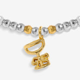 Joma Jewellery Fizz The Season silver and gold-plated bracelet close-up of the gold-plated champagne coupe and bow charm