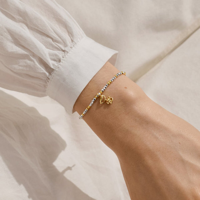 Joma Jewellery Fizz The Season silver and gold-plated bracelet worn on a wrist
