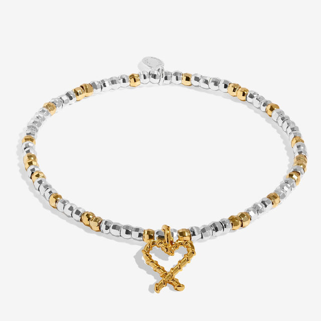 Joma Jewellery Naughty And Nice silver and gold-plated bracelet shown in full with its charm