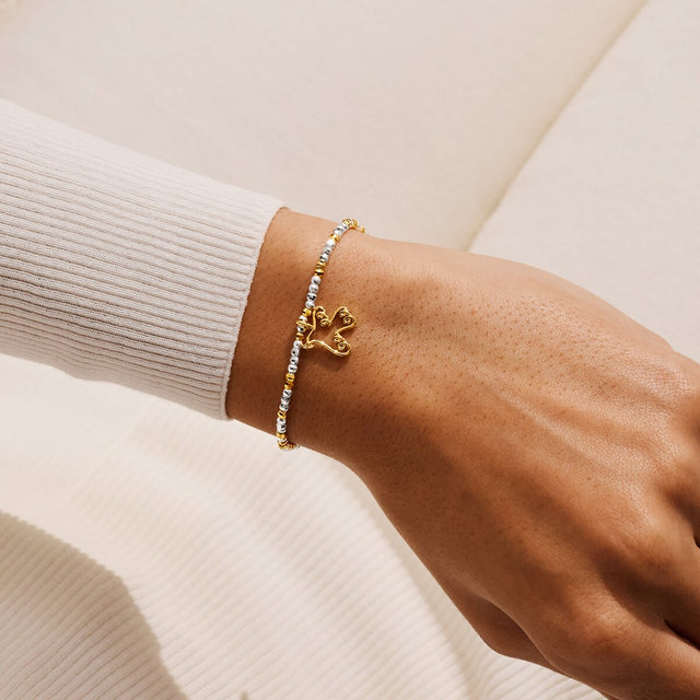 Joma Jewellery Noel silver and gold-plated bracelet worn on a wrist