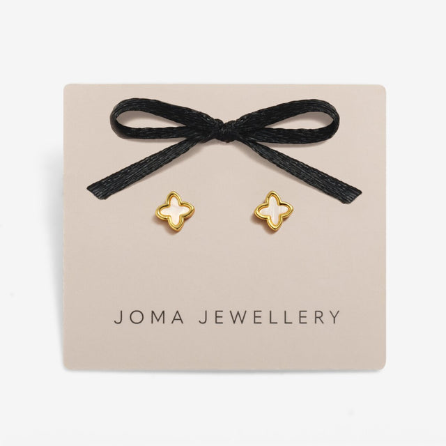Gold clover earrings presented on Joma Jewellery gift card