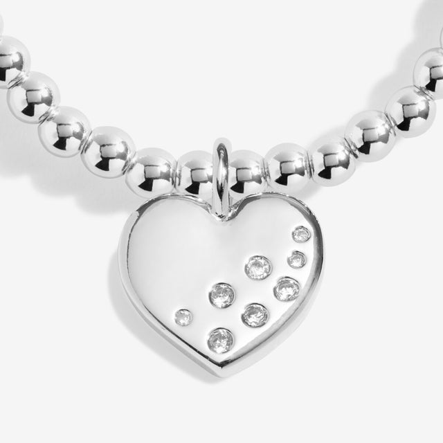 Close-up of heart charm on Joma Jewellery Confetti A Little 21st Birthday silver-plated bracelet