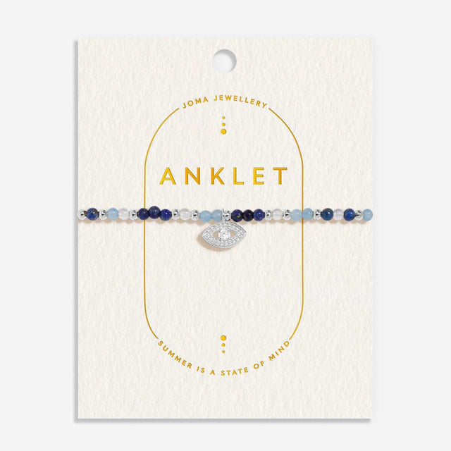 Joma Jewellery evil eye silver anklet on gold-foiled buttercream card