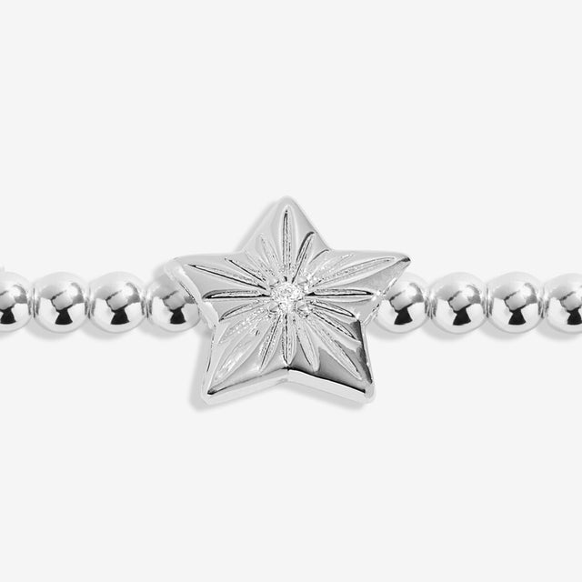 Close-up of star charm on Joma exam results silver bracelet