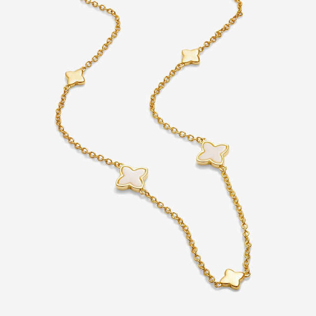 Gold clover necklace chain detail with clover charm accents