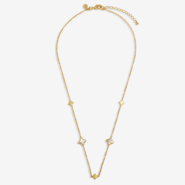 Gold clover necklace with delicate chain and clover charms