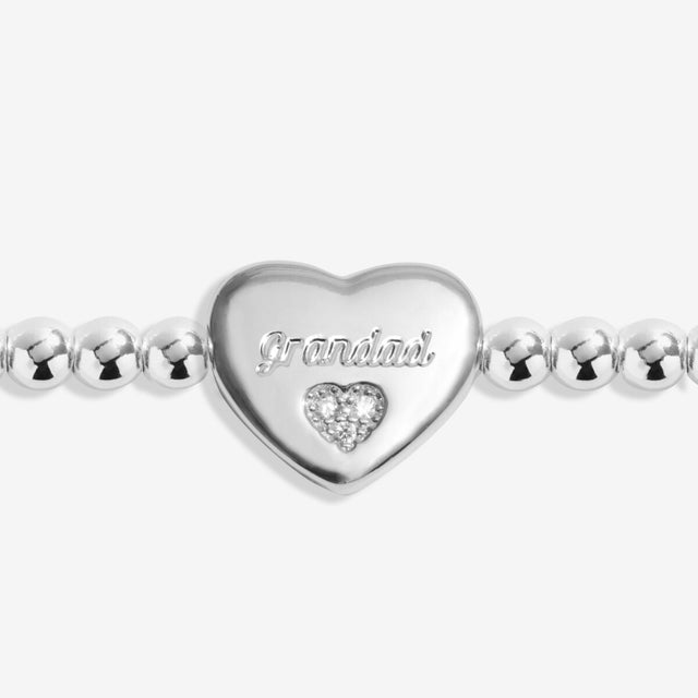 Close up of heart charm engraved Grandad on silver remembrance bracelet