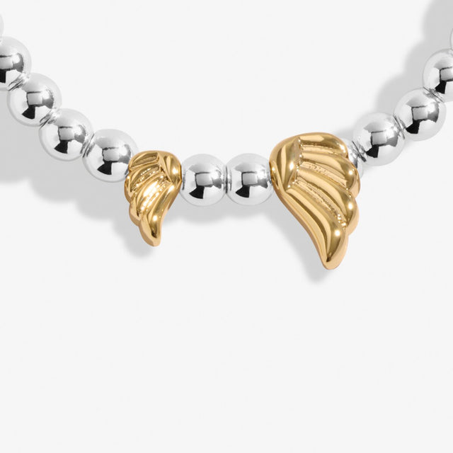 Close-up of gold angel wing charms on silver beaded Guardian Angel bracelet
