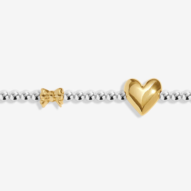 Close-up of gold heart charm on Joma Jewellery January bracelet