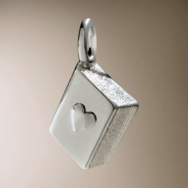 Joma Jewellery silver-plated book charm bracelet designed as a gift for readers