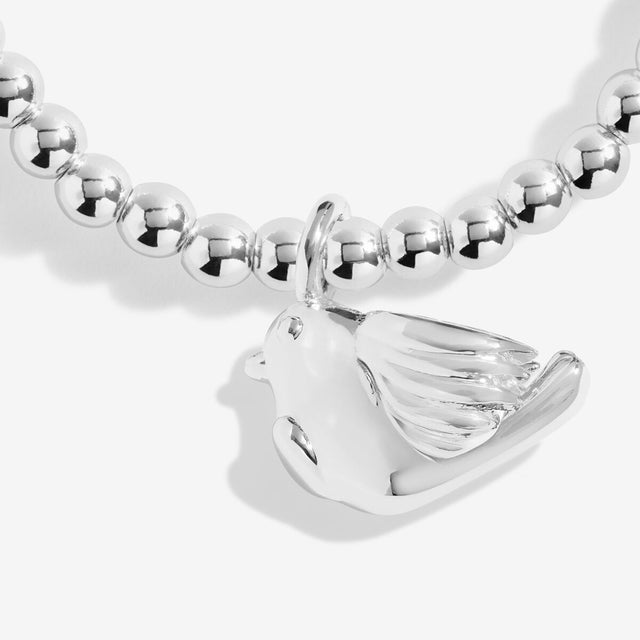 Close-up of the robin charm on Joma Jewellery's Christmas Robin silver-plated bracelet