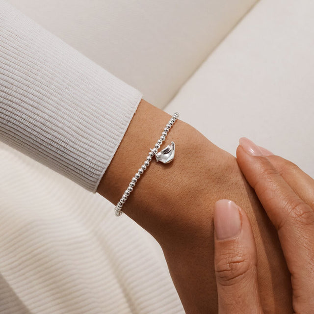 Joma Jewellery Christmas Robin silver-plated bracelet with robin charm worn on a wrist