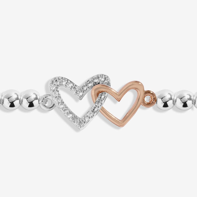 Joma Jewellery daughter bracelet with interlinked silver and rose gold double heart charm
