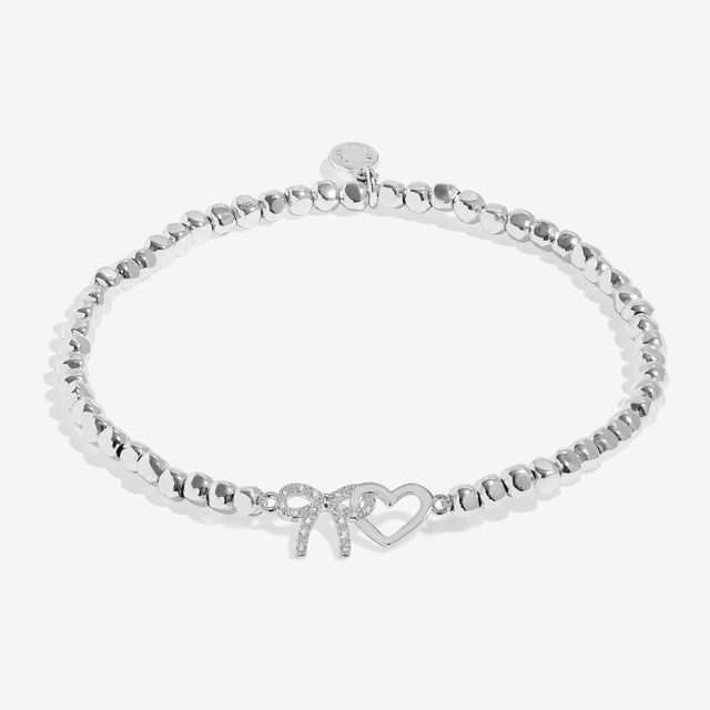 Joma Jewellery From Me To You Thank You silver bracelet with interlinked bow and heart charms