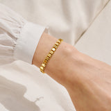Joma Jewellery gold heart chain bracelet styled as an elegant jewellery gift for her