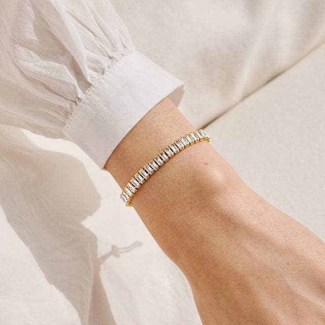 Joma Jewellery gold cubic zirconia tennis bracelet styled on the wrist