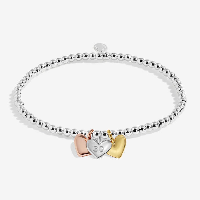 Joma Jewellery Happy 30th Birthday bracelet with silver, gold and rose gold heart charms