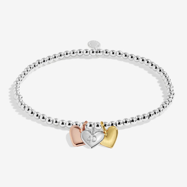Joma Jewellery Happy 40th Birthday bracelet with silver, gold and rose gold heart charms