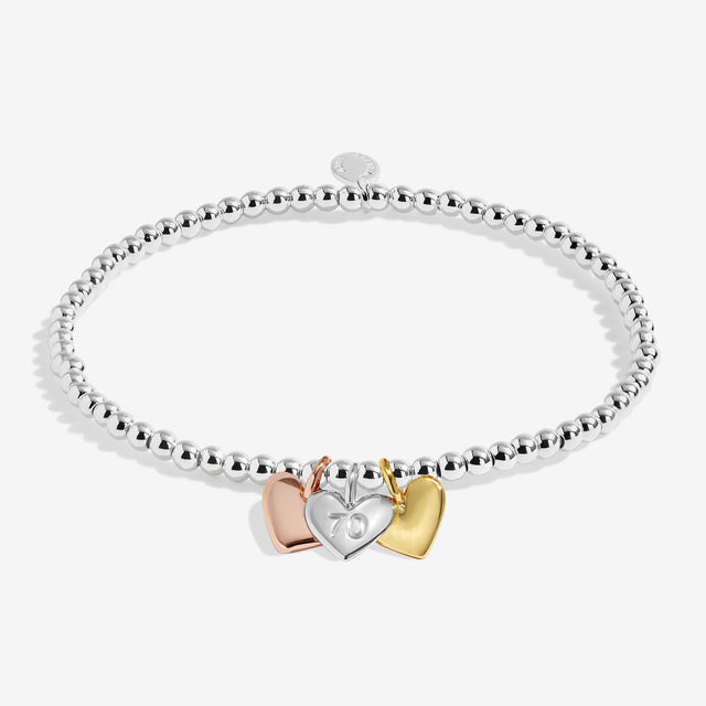 Joma Jewellery Happy 70th Birthday bracelet with silver, gold and rose gold heart charms