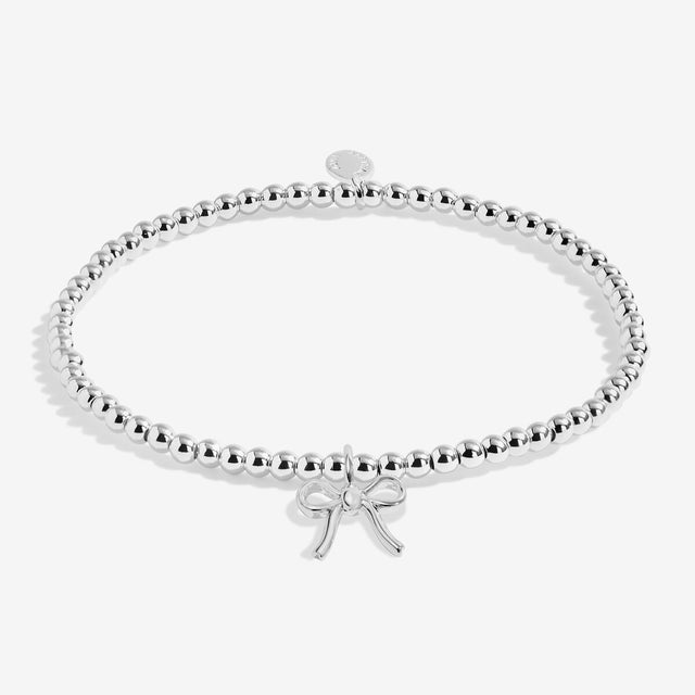Joma Jewellery Happy Christmas kids' silver-plated beaded bracelet with ribbon bow charm
