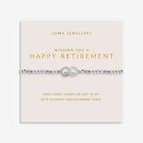Joma Jewellery Wishing You A Happy Retirement bracelet displayed on a blush pink sentiment card
