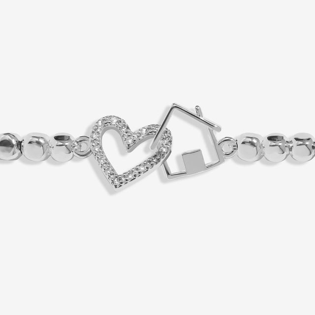Interlinked silver heart and house charms on Joma Jewellery New Home bracelet