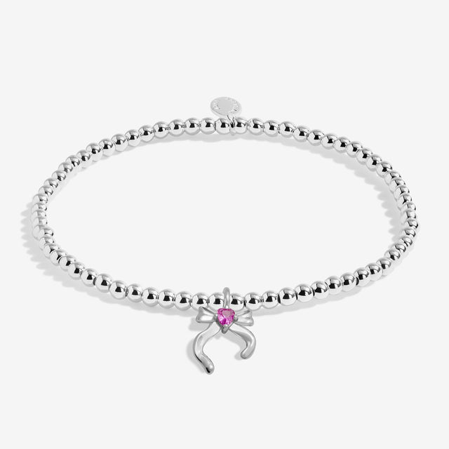 Joma Jewellery Merry Christmas Daughter kids' silver-plated beaded bracelet with bow charm with a pink heart detail