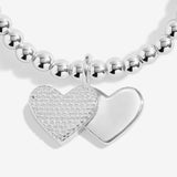 Close-up of the double heart charm on Joma Jewellery's Merry Christmas Fabulous Friend silver-plated bracelet