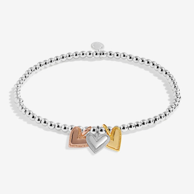 Joma Jewellery A Little Charmed Moments New Chapter bracelet with silver, gold and rose gold heart charms