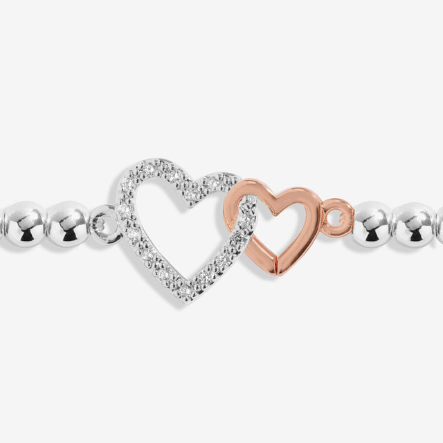 Joma Jewellery niece bracelet with interlinked silver and rose gold heart charms
