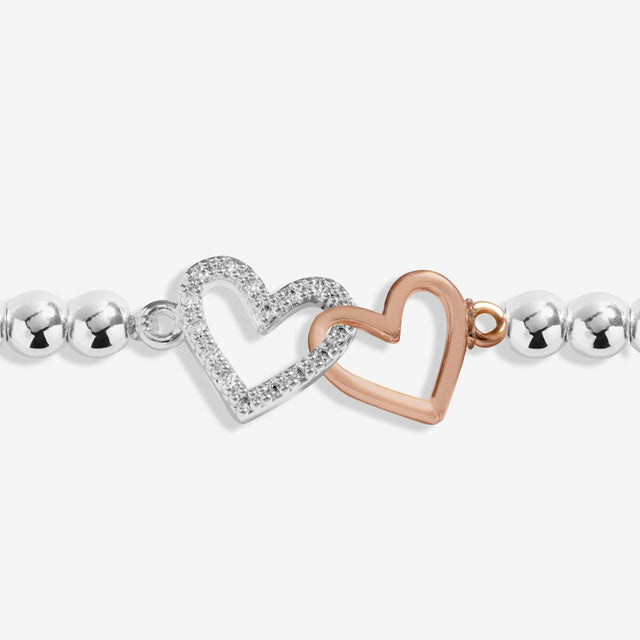Joma Jewellery sister bracelet with interlinked silver and rose gold heart charms