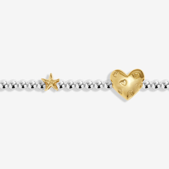 Close-up of heart charm on Joma Jewellery July birth month bracelet