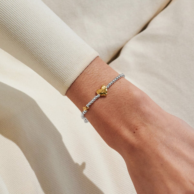 Joma Jewellery July birth month silver and gold-plated bracelet worn on wrist