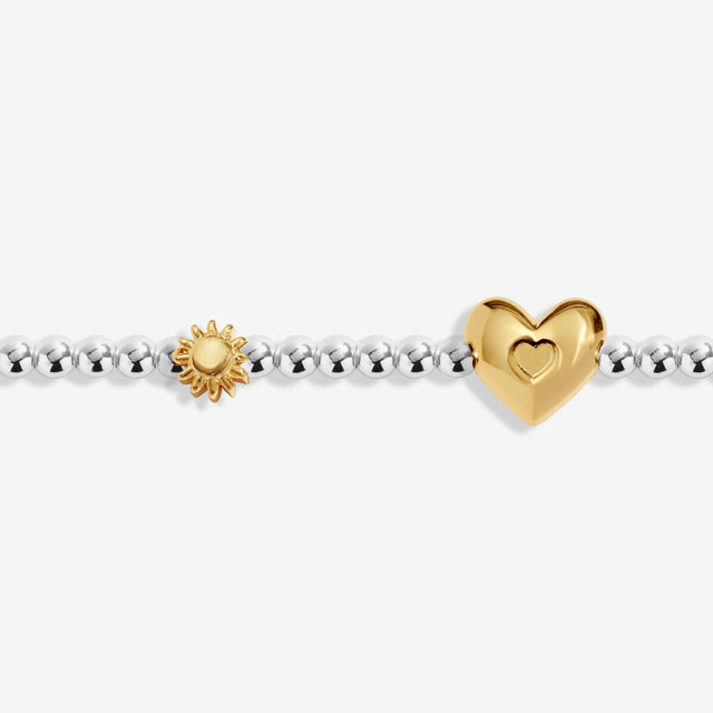 Close-up of heart charm on Joma Jewellery June birth month bracelet