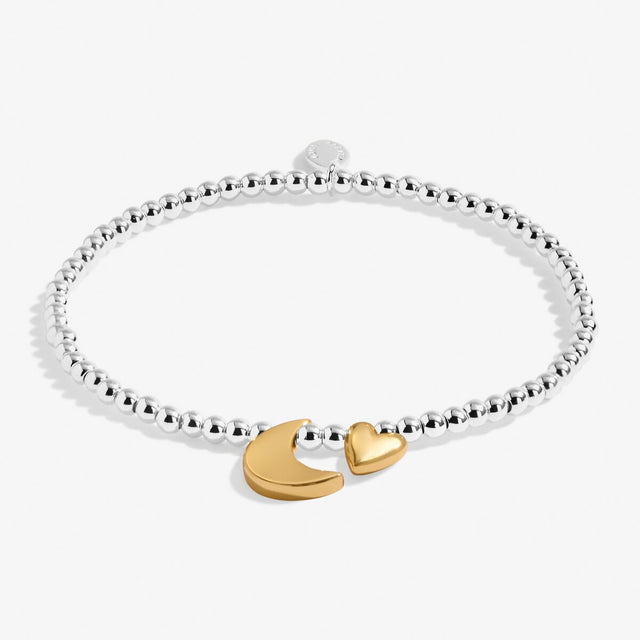 Silver charm bracelet with gold moon and heart charms by Joma Jewellery