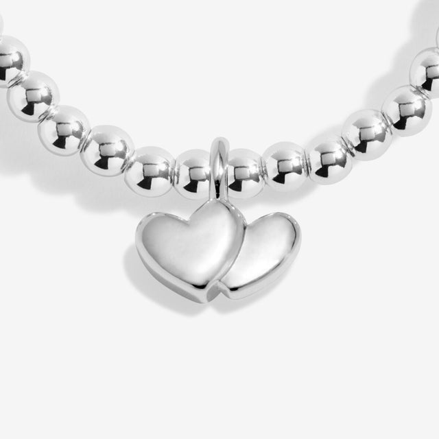 Double heart charm detail on Joma Jewellery Lovely Friend silver bracelet