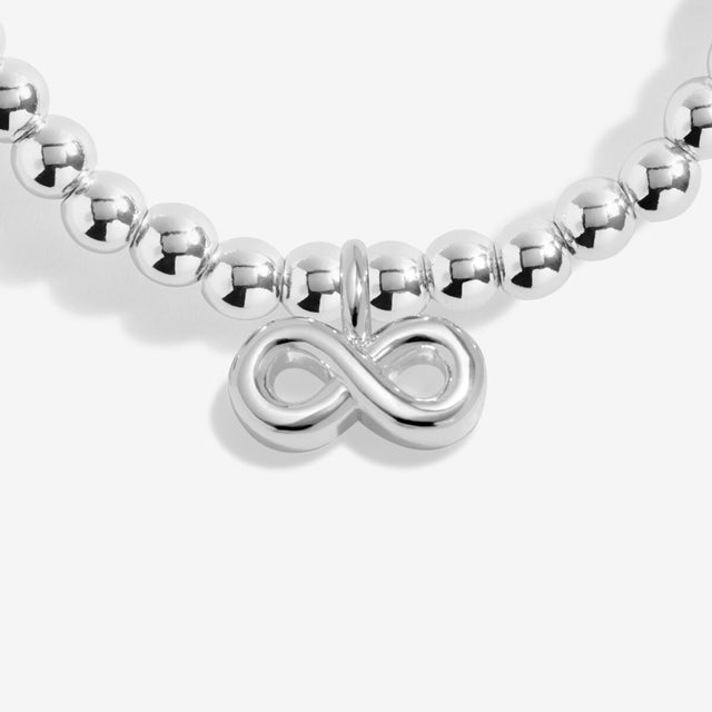 Silver infinity charm detail on Lovely Friend bracelet symbolising friendship