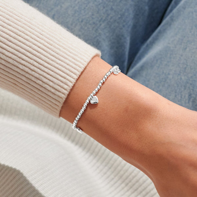 Joma Jewellery Lovely Friend silver charm bracelet worn on wrist
