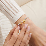 Lovely Mum bracelet for mums worn on wrist with gold heart charms