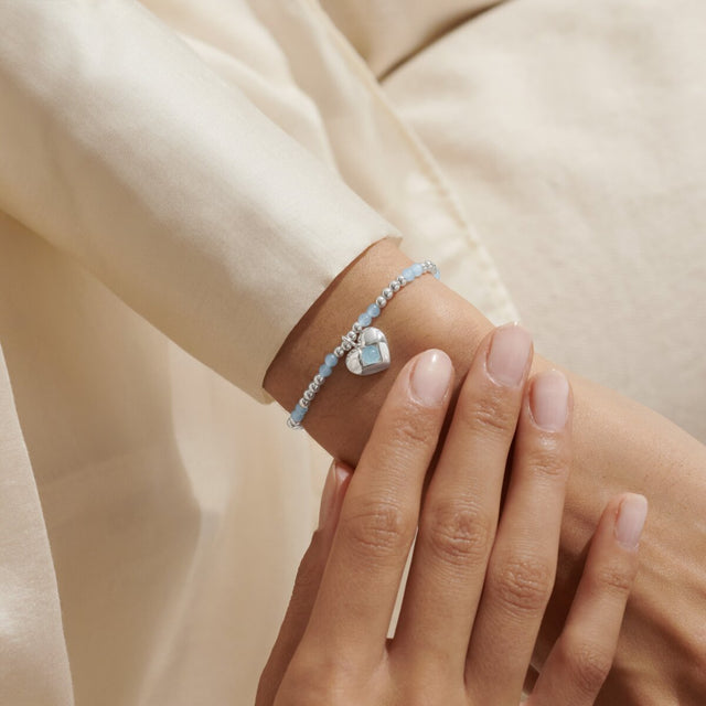Joma Jewellery March aqua crystal birthstone bracelet worn on wrist