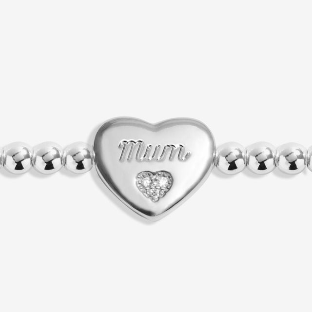 Close up of heart charm engraved Mum on silver remembrance bracelet